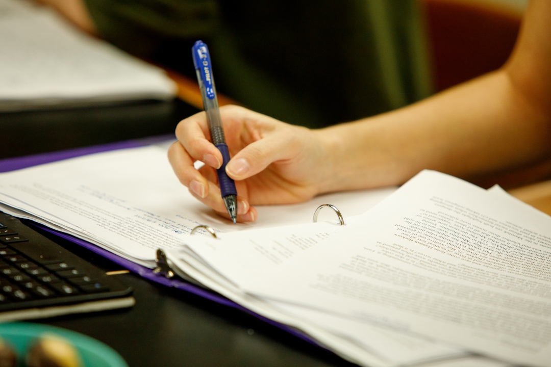 Student taking notes in class