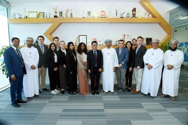 Professor Mohssen Esseesy and GW students at the Bank Musqat.